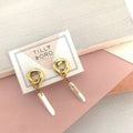 Cycles with pearl drop earrings
